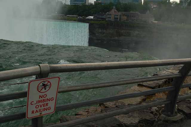 No climbing the rail sign